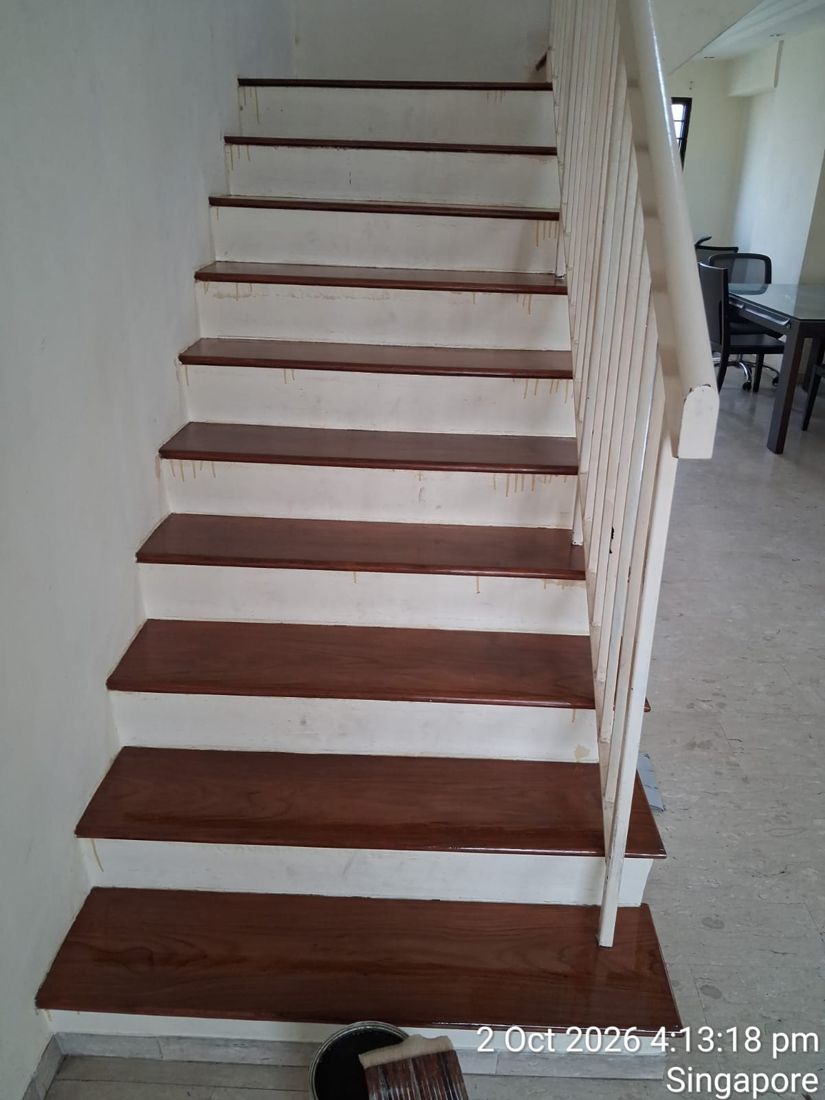 Dark-stained timber stair treads with white risers